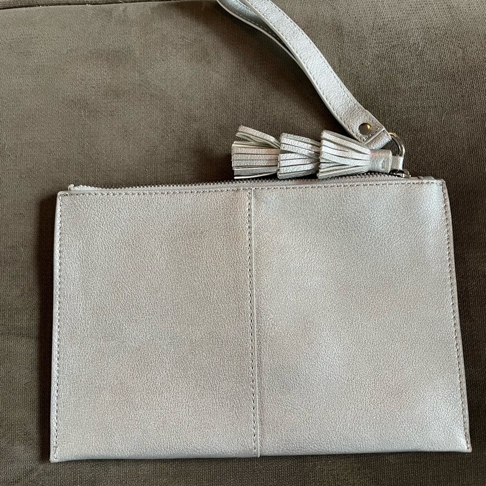 INC International Concepts silver pouch. Vegan leather. Tassel/wristlet Top zip